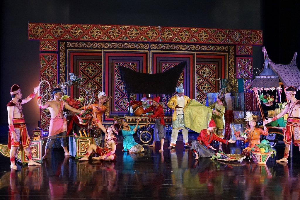 Devdan Show at Bali Nusa Dua Theatre with performers in colorful traditional Indonesian costumes on a bright stage