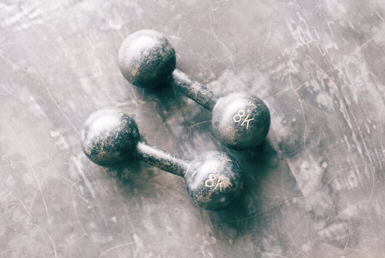 two grey light dumbbell