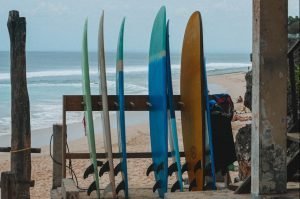 a group of surfboards sitting on top of Uluwatu sandy beach