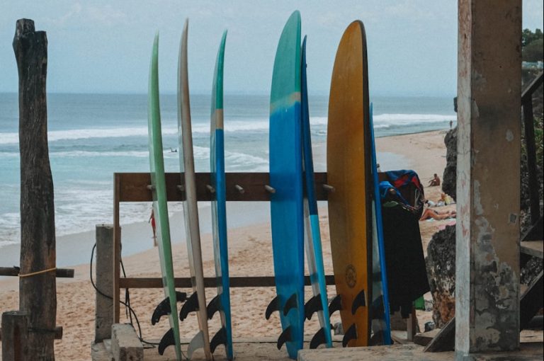 a group of surfboards sitting on top of Uluwatu sandy beach