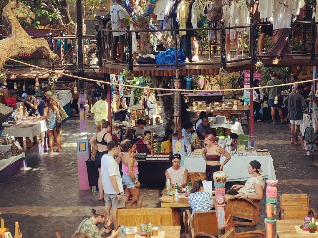 Visitors browsing Sundaze Sunday Market in Uluwatu, Bali