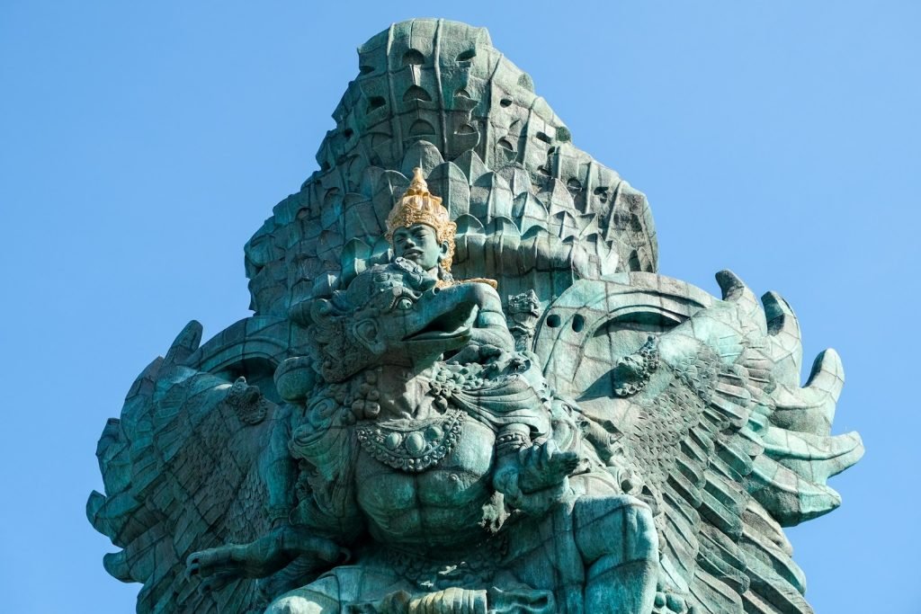 a statue of an elephant with a bird on its back - Garuda Wisnu Kencana (GWK)